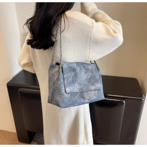 Detailed macro view of vintage blue marble texture on large capacity chain tote bag