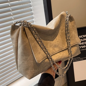Large taupe suede tote bag with stylish silver chain shoulder strap and leather texture