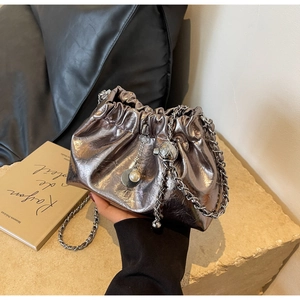 Silver metallic bucket bag with chain strap, pearl charm and drawstring detail
