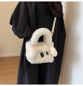 Detail of plush faux fur crossbody bag with cute eye embroidery and 3D ears