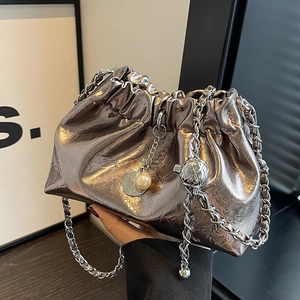 Silver metallic pleated cloud bucket bag with chain strap and pearl pendant detail