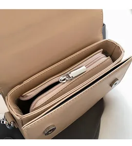 Detailed interior of apricot crossbody bag showing smooth zipper pocket and magnetic closure