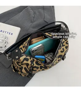 Detail view of large leopard print tote bag with spacious interior for tablet and phone