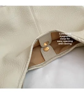 Detail of invisible magnetic clasp and premium lychee pattern leather on tote bag