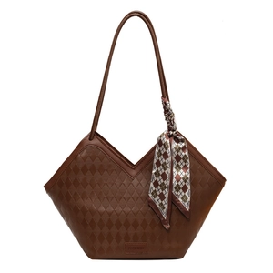 Large brown quilted faux leather tote bag with V-shaped top and decorative silk scarf