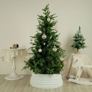 White knitted Christmas tree collar with chunky cable pattern for holiday tree decoration