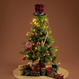 Detail of red and black buffalo plaid top hat topper on a decorated Christmas tree