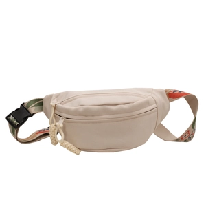 Minimalist cream canvas crossbody bag with colorful floral embroidered strap and buckles