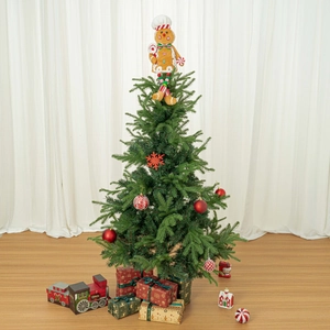 Festive Christmas tree with gingerbread topper, red ornaments and gift boxes scene