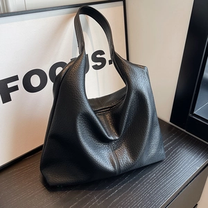 Large black pebbled leather tote bag with minimalist design for work and daily use