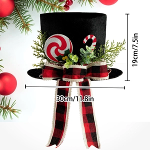 Black Christmas tree topper top hat with buffalo plaid bow and candy cane decorations