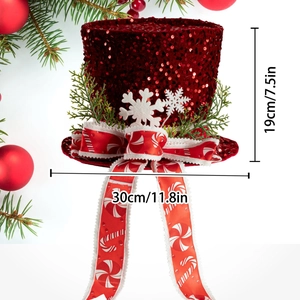 Red sequined Christmas tree topper hat with white snowflakes and green pine needles