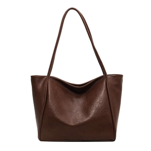 Minimalist large capacity dark brown faux leather tote bag with soft texture and handles