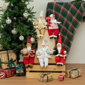 Detailed close-up of five 12-inch sitting Santa Claus figurines in various festive costumes