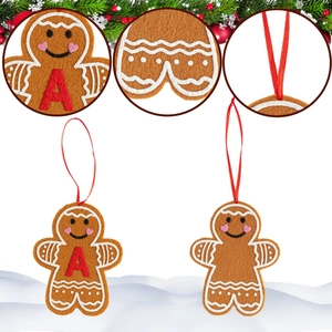 Detailed close-up of felt gingerbread man Christmas ornament with red letter A embroidery