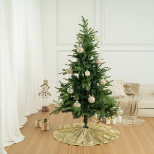 Sparkling gold sequin Christmas tree skirt in a cozy and bright festive indoor scene