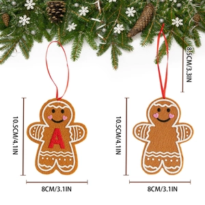 Gingerbread man felt ornaments with red letter A and festive pine decorations