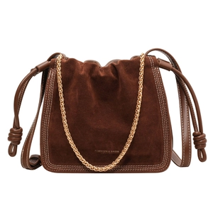 Retro dark brown suede bucket bag with gold chain strap and drawstring closure