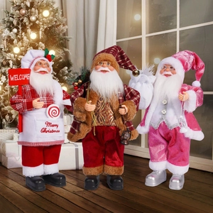 Detailed view of three decorative Santa Claus figurines in various festive costumes