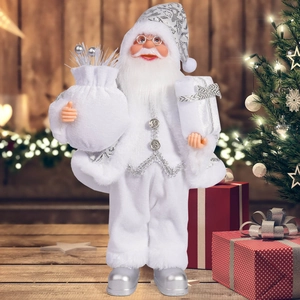 Detail of Santa Claus figurine in elegant white and silver outfit with embroidery and gift bag