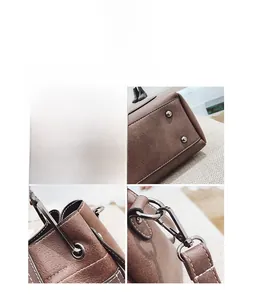 Détails d'un sac en cuir marron avec surpiqûres blanches et garnitures métalliques