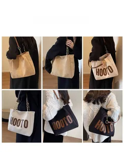 Three colors of canvas tote bags with leather chain straps shown in a lifestyle indoor setting