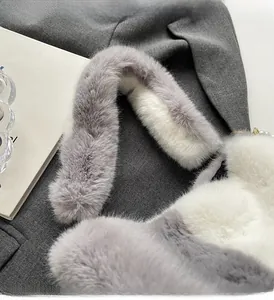 Close-up of soft plush faux fur handle and thick texture on a winter bucket bag