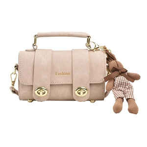 Elegant beige crossbody small square bag with top handle and plush bunny charm accessory