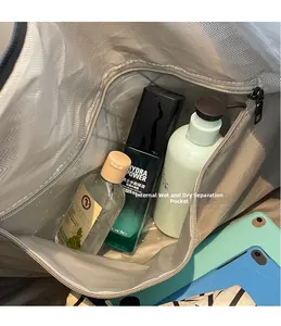 Detail view of large travel bag featuring a waterproof dry and wet separation pocket
