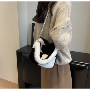 Contrast plush faux fur shoulder bag with pearl chain strap and gold-tone metal hook detail