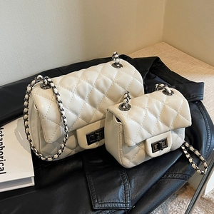White diamond quilted flap bags with silver chain straps and metallic turn-lock closure