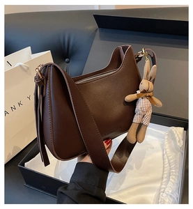 Brown faux leather crescent hobo bag with cute bunny charm in a premium gift box