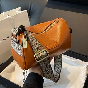 Caramel orange Boston shoulder bag with vintage leather finish and wide jacquard strap