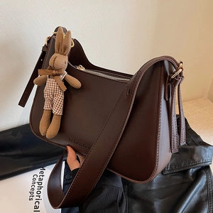 Vintage dark brown half-moon shoulder bag in PU leather with a cute rabbit charm
