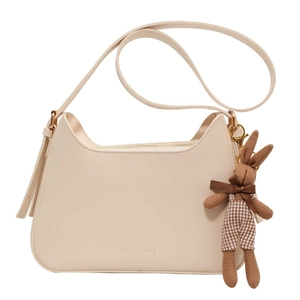 Cream vintage crossbody bag with half-moon shape and a retro fabric bunny charm