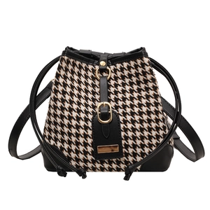 Chic houndstooth bucket bag with black leather trim and drawstring closure for women