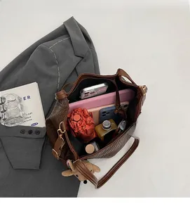 Top view of spacious woven tote bag showing internal storage for laptop and essentials