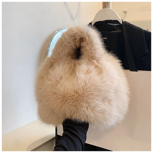 Detailed close-up of soft fluffy plush beige brown handbag with premium faux fur texture