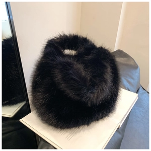 Macro detail of high-quality black faux fur texture on a thick plush winter neck warmer