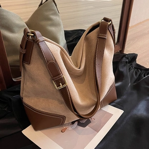 Chic beige canvas and brown leather tote bag with adjustable strap for daily use