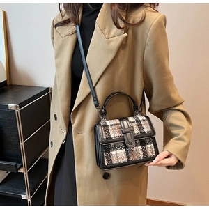 Chic tweed crossbody bag featuring retro plaid pattern and elegant black leather trim