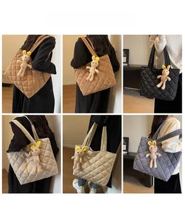 Quilted nylon tote bag in various colors with a cute plush rabbit pendant charm