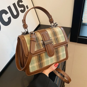 Vintage checkered tweed handbag with brown leather trim and metallic buckle closure