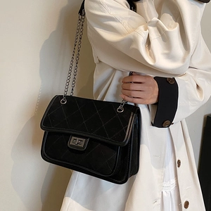 Quilted black chain crossbody bag for women with elegant metal turn-lock and chain strap