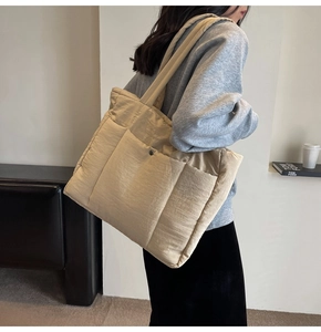 Quilted tote bag showing large capacity and rectangle stitched texture on shoulder