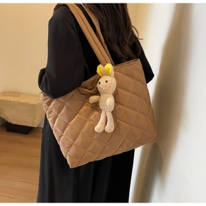 Quilted nylon tote bag in khaki featuring a plush bunny charm and diamond stitch pattern