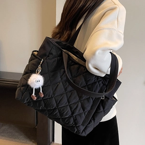 Large black quilted nylon tote bag with rhombus pattern and cute plush charm on shoulder