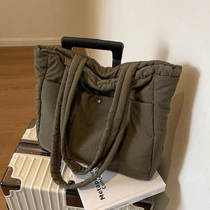 Olive green quilted nylon tote bag with large capacity for commuting and travel use