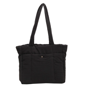 Large black quilted nylon tote bag for women with silver metal button and shoulder strap