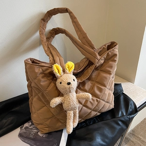Brown quilted nylon tote bag with rhombus pattern and plush bunny pendant charm